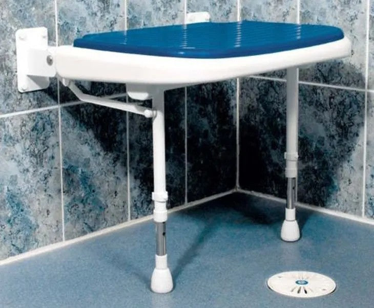 Blue and white adjustable shower seat mounted on a tiled bathroom wall.