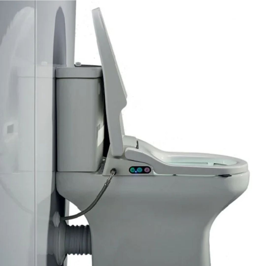 A close-up side view of a white toilet with the lid and seat open, showing a small control panel with colored buttons on the rim and a hose connected to the tank.