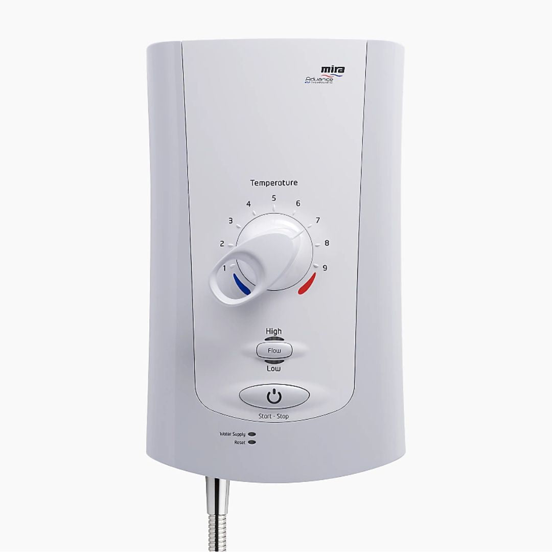 A white Mira electric shower with a central temperature dial, flow and low-pressure protection buttons, and a flexible metal hose at the bottom, shown against a light gray background