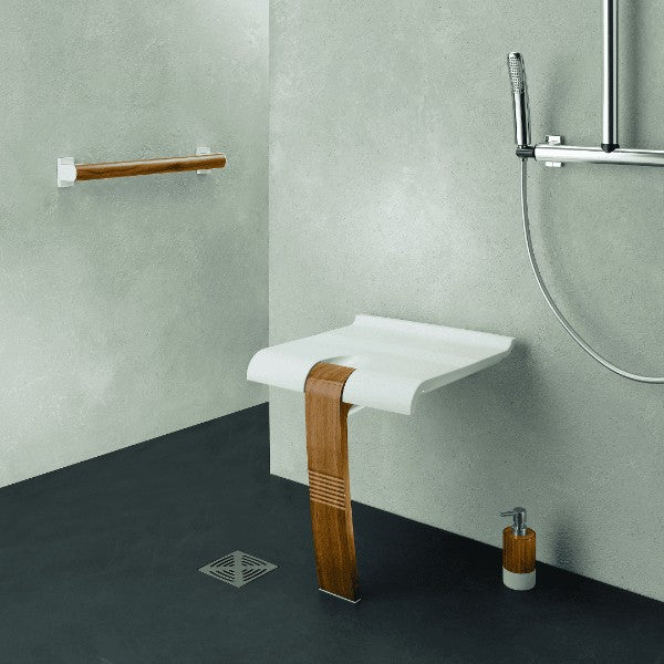 White shower seat with wooden leg, in modern bathroom setting