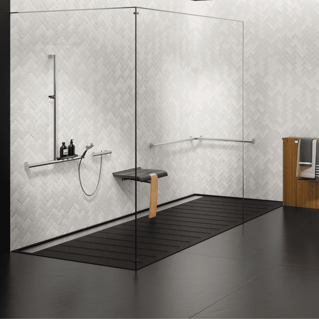 Modern shower enclosure with glass door, shower head, and towel rack in a bathroom setting.