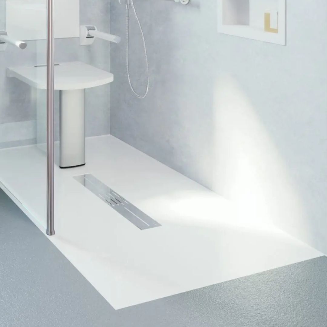 Bathroom setting with a shower tray and wall-mounted shower head.