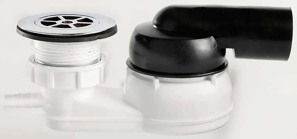 Close-up of a black and silver drain and faucet on a white background