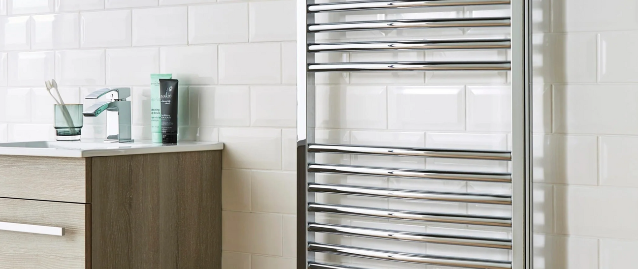 Chrome towel rail in modern bathroom setting