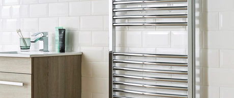 Chrome towel rail in modern bathroom setting