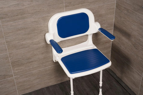 Blue and white shower chair against a tiled bathroom wall.