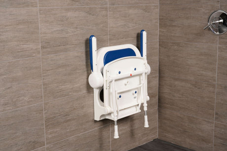 Wall-mounted shower seat with blue backrest against a tiled bathroom wall.