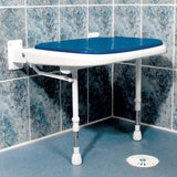 Blue and white adjustable shower seat mounted on a tiled bathroom wall.