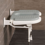 side on view of shower seat in bathroom setting