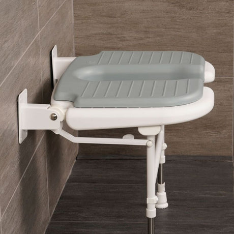 side on view of shower seat in bathroom setting