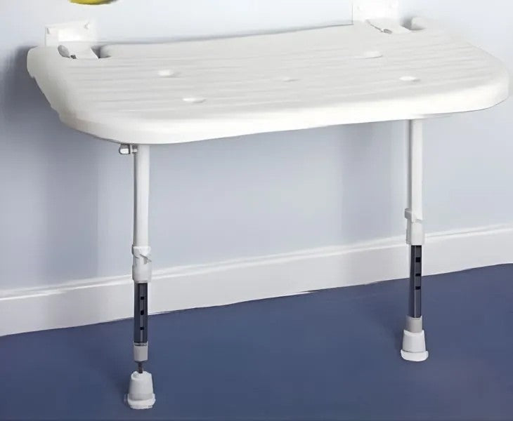 Adjustable shower seat with white plastic seat and black metal legs on a blue floor.