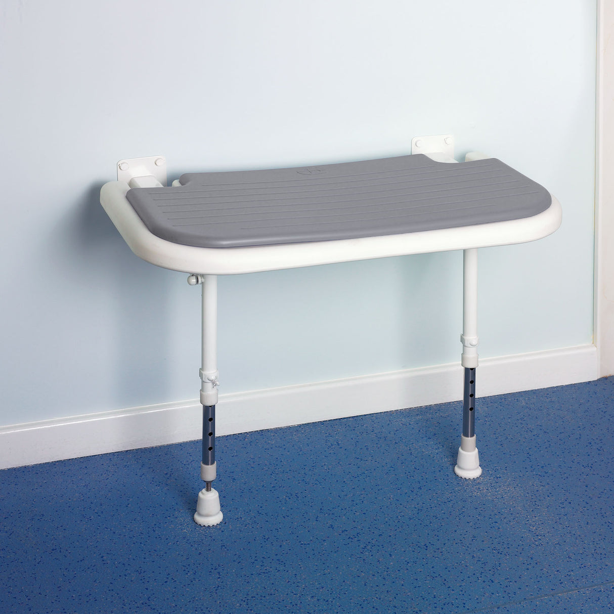 grey shower seat in place