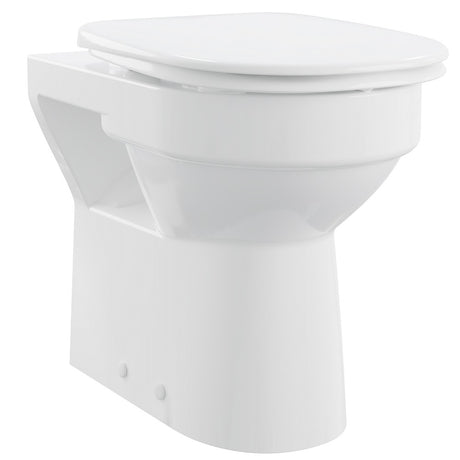 White toilet bowl with closed lid on a white background
