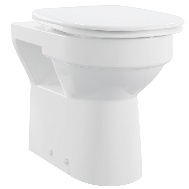White toilet bowl with closed lid on a white background