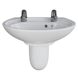 A white ceramic pedestal bathroom sink with two chrome faucets, shown against a plain white background.