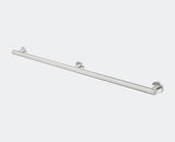 Metallic towel bar on a light gray background