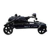 Folded mobility scooter on a white background