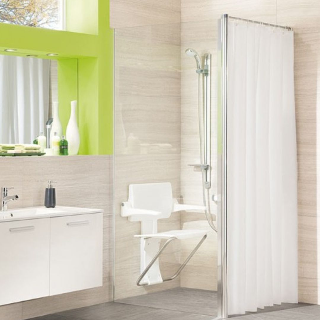 Bathroom with shower area, sink, and mirror