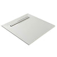 A square white wetroom former with a recessed linear drain channel, shown at an angle on a solid white background.