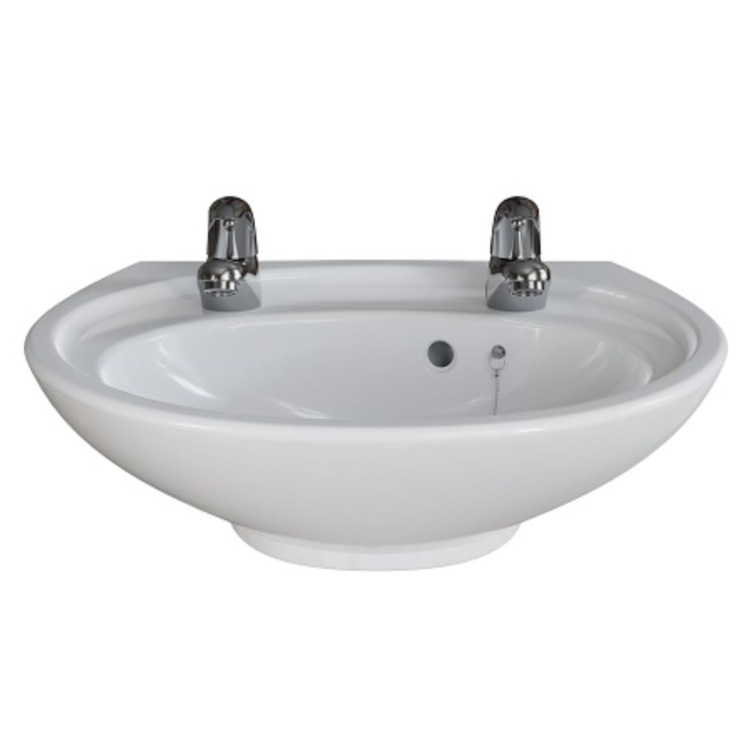 A white ceramic bathroom sink with two polished chrome faucets, shown against a plain white background.