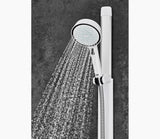 Handheld shower head with water flowing against a dark gray background