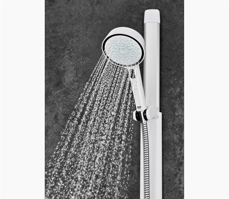 Handheld shower head with water flowing against a dark gray background