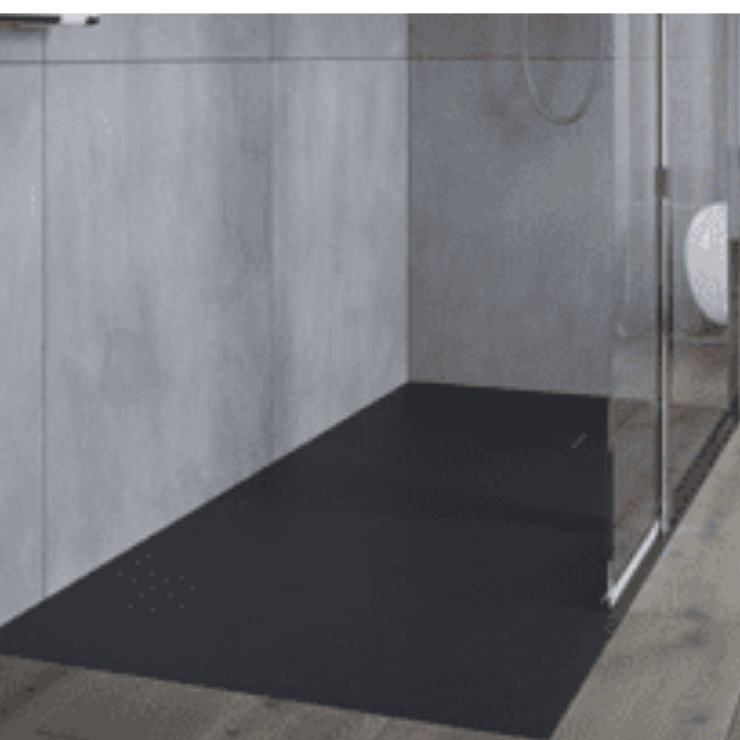 Black shower tray in a shower enclosure with gray walls.