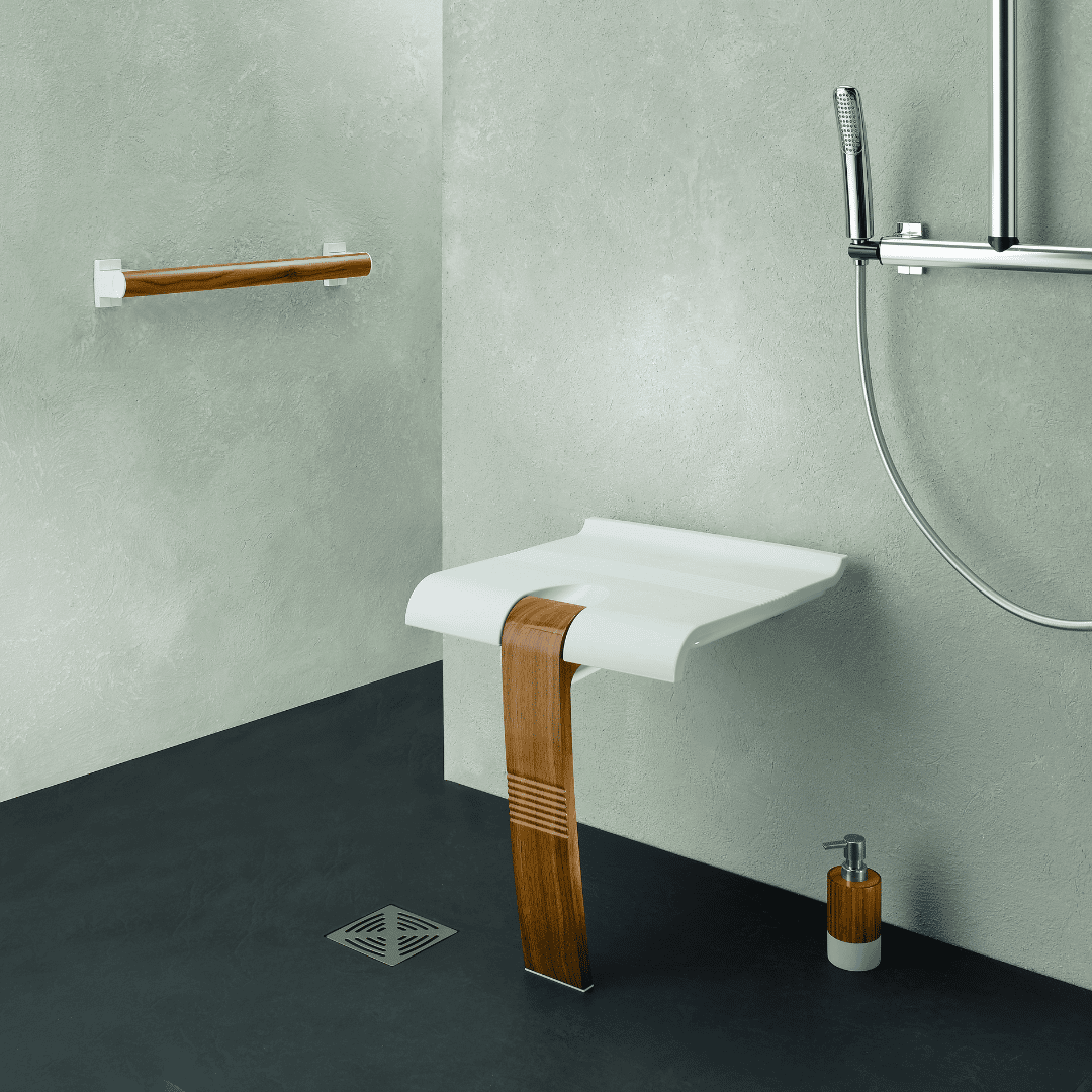 Bathroom setting with a white sink on a wooden stand against a gray wall.
