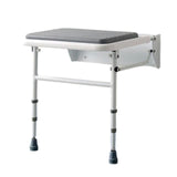 A wall-mounted shower bench with a gray padded seat and a white metal frame with adjustable legs, shown against a plain white background.