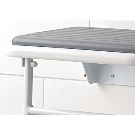 White desk with a gray cushion on a white background