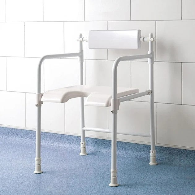 White freestanding shower seat against white wall