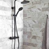 Shower setup with black fixtures on a tiled shower wall.