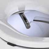 Close-up of a white toilet seat with an integrated bidet sprayer and water stream visible inside the bowl.