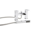 Chrome bathtub faucet with handheld shower head on a white background