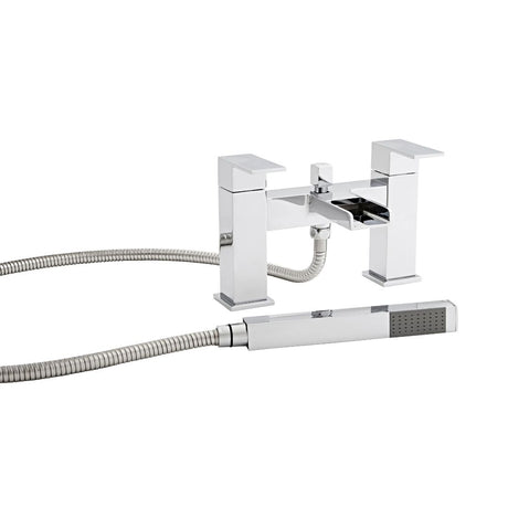 Chrome bathtub faucet with handheld shower head on a white background