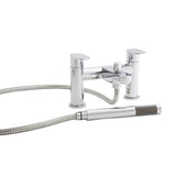 Chrome bath filler and shower attachment on a whilte background 