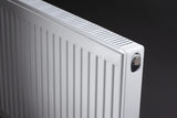 Close up of white radiator on a black background