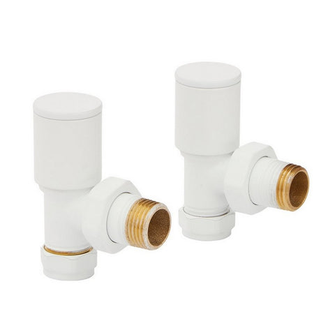 Two white plumbing valves with brass connectors on a white background
