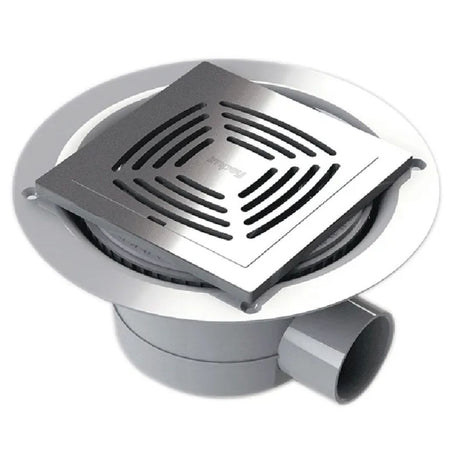 A square tiled stainless steel wetroom waste with a slotted grate cover, set inside a round gray drain flange with a gray pipe outlet.