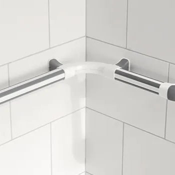 Corner shower bar mounted on a tiled shower wall