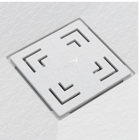 A square white textured tile with a recessed geometric maze-like pattern in the corners and a small embossed logo in the center, shown on a matching light gray textured background.