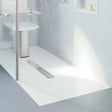Bathroom setting with a shower tray and wall-mounted shower head.