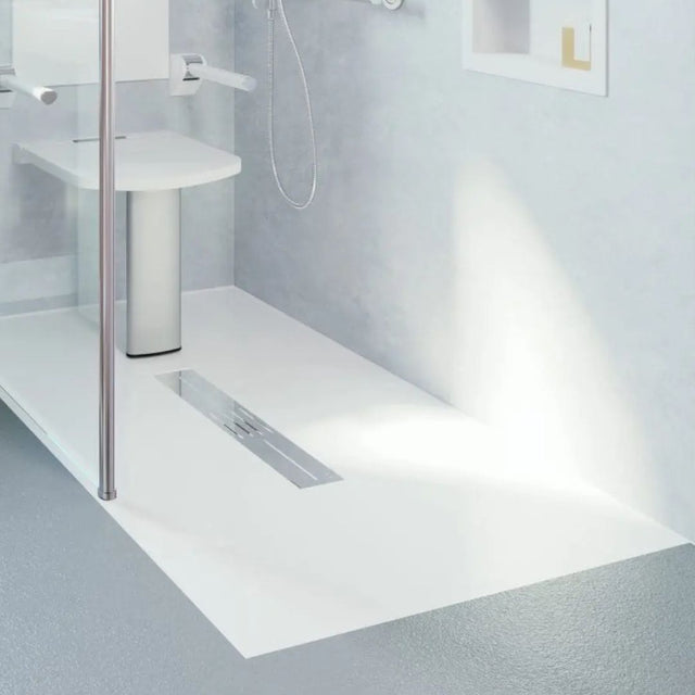 Bathroom setting with a shower tray and wall-mounted shower head.