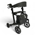A black four-wheel rolling walker with a padded backrest, seat, and a matching black storage bag featuring a reflective silver stripe, shown on a white background.