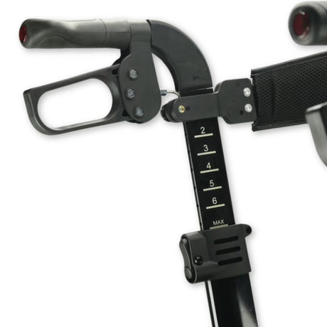 Close-up of a black adjustable rollator handlebar assembly with grip controls and a height adjustment scale marked 2 through 6 MAX, on a white background.