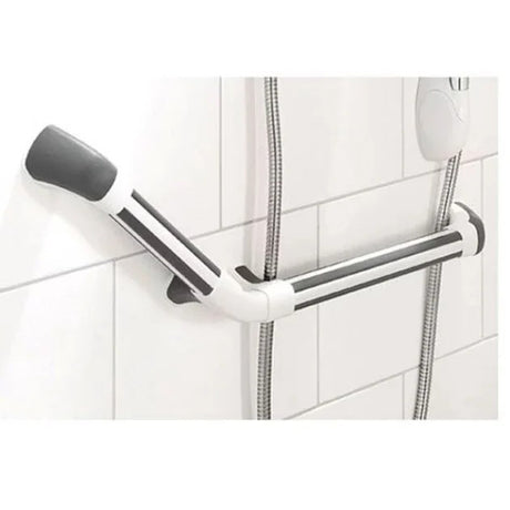 Metal grab bar mounted on a tiled bathroom wall with a shower head in the background.