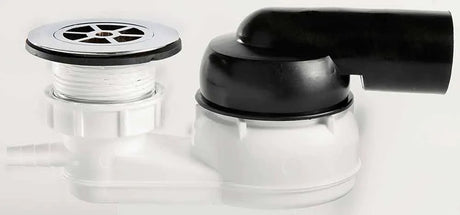 Close-up of a black and silver drain and faucet on a white background