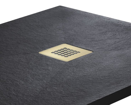 A square dark charcoal slate shower floor with a square inset brass drain grid, shown on a clean white background.